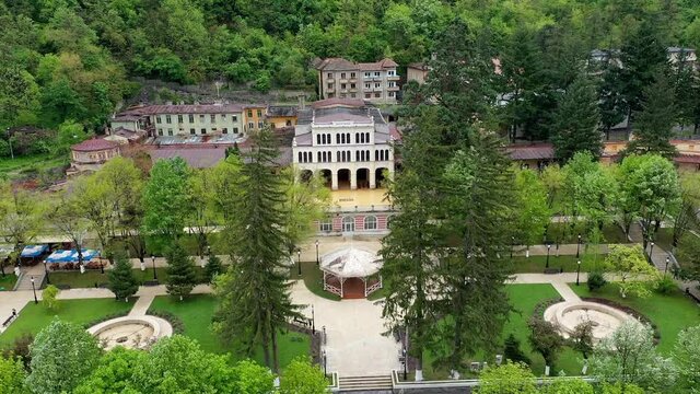 4K Aerial drone view of Baile Herculane - Thermal resort in Romania, gorgeous Austro-Hungarian Imperial Baths between the mountains