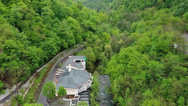 4K Aerial drone view of Baile Herculane - Thermal resort in Romania, gorgeous Austro-Hungarian Imperial Baths between the mountains