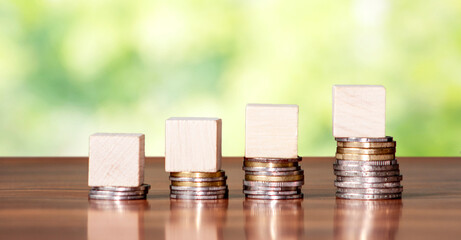 Empty wooden cube block on steps made with coin. Growth