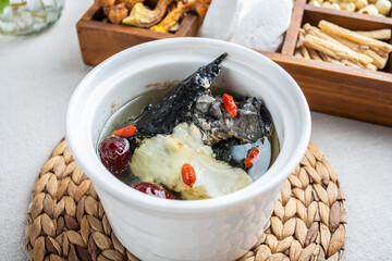 Stewed black-bone chicken with red dates and angelica in Chinese health soup