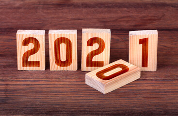 Wooden block with numbers 2021. Concept of beginning of new year