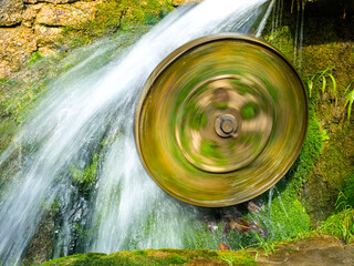 a mill wheel spins fast from the water_1