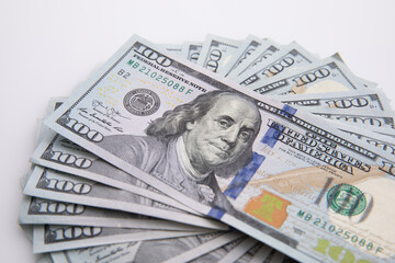 collection of hundred-dollar banknotes isolated on white background, close view