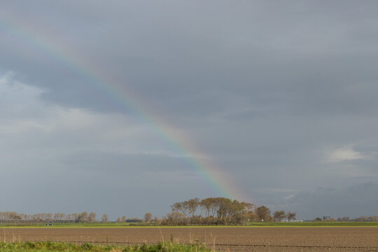 Rainbow in a flatland landscape in the autumn