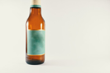 a bottle of beer with a light blue label on a white background