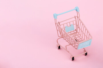 Lovely pink shopping cart on pink background, empty shopping cart, shopping concept, online shopping - Powered by Adobe