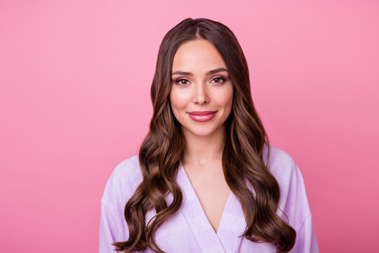 Closeup photo of beautiful lady long curly hairstyle spa salon procedure feel well look mirror preparing romantic date like her reflection wear bathrobe isolated pastel pink color background