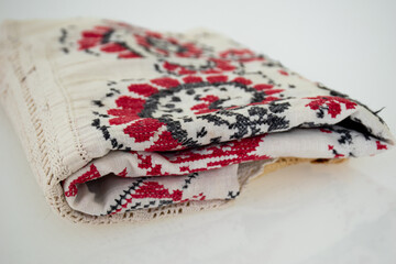 Vintage embroidered fabric on white background