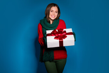 Fototapeta premium Portrait of her she nice attractive charming cheerful cheery girl wear knitted cloth holding in hands romantic giftbox 14 February Valentine isolated bright vivid shine vibrant blue color background