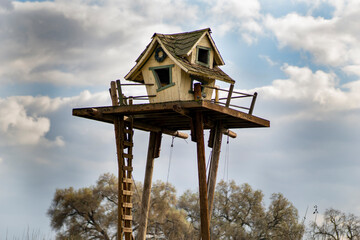 Tall tree house on a farm
