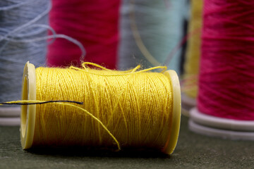 close-up spools of threads on background 