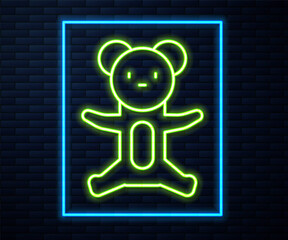 Glowing neon line Teddy bear plush toy icon isolated on brick wall background. Vector.