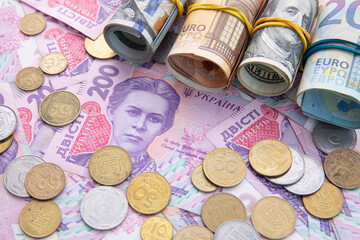 collection of dollar and hryvnia with euro banknotes and coins, close view