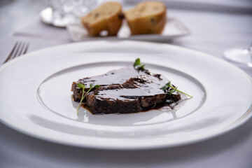 Beefsteak specialty prepared in olive oil with mashed potatoes