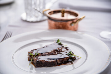 Beefsteak specialty prepared in olive oil with mashed potatoes