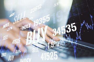 Double exposure of abstract creative financial chart with hand typing on computer keyboard on background, research and strategy concept