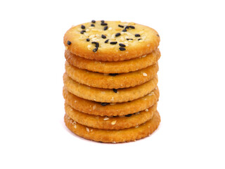 Pile of round sesame crackers isolated on white