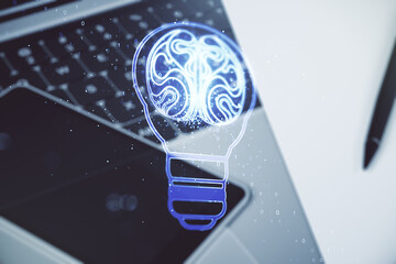 Creative idea concept with light bulb and human brain illustration on modern laptop background....