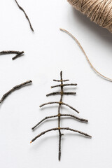 Christmas tree decoration made from natural materials of branches. Flat lay, copy space
