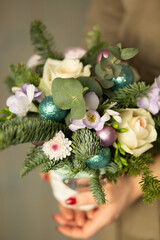 Christmas bouquet of fir and roses for a gift and a holiday
