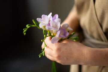 woman holding a flower