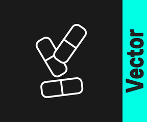 White line Vitamin complex of pill capsule icon isolated on black background. Healthy lifestyle. Vector.