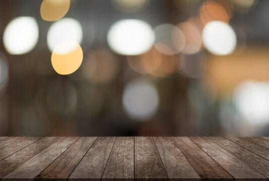 Empty wood table on blur restaurant background.	