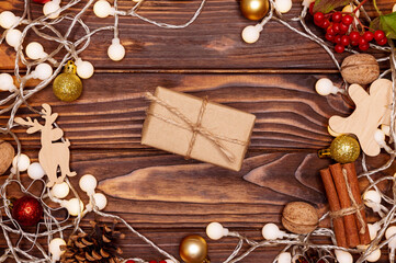 Rustic gift box on wooden background.Christmas gift on wooden board