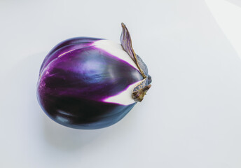 Beautiful purple eggplant on white background with copy space