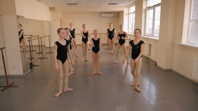Elegant young teenage girls are engaged in ballet in a ballet Studio. Childhood, dancing, lifestyle concept.