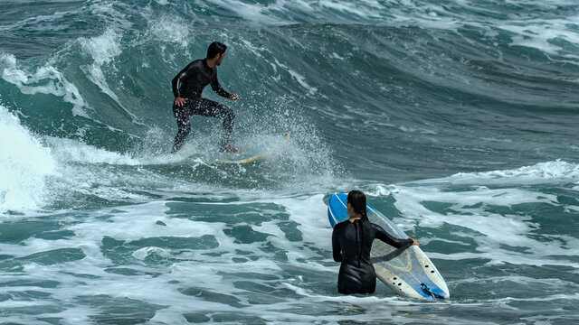 surfing on the beach of la cicer in Las Plamas de GRan Canaria