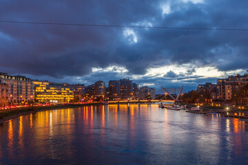 Fototapeta premium city bridge landscape and office buildings architecture skyline cloeds night