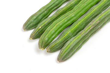 Sliced cut Moringa oleifera (drum stick) pods isolated on white background.