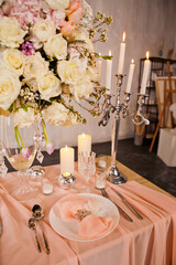 Beautiful wedding bouquet of many roses in a glass vase. Close-up