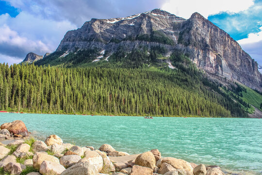Banff National Park, Alberta, Canada: June 30, 2019 - Landscape picture of the mountain, lake, forest, and sky in the Banff National Park.