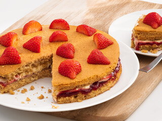 A Vegan Victoria Sandwich cake with strawberries