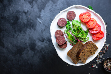 black pudding and vegetables meal ingredient on the table tasty portion top view copy space for text food background rustic 