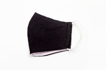 Black face mask corona virus or covid-19 protection isolated on a white background.
