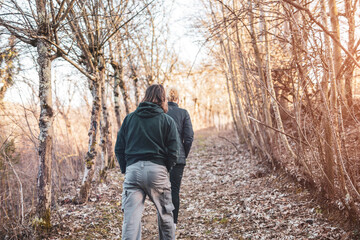 Naklejka na ściany i meble Couple walking in nature, recreational outdoor pursuit.