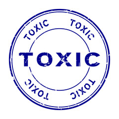 Grunge blue toxic word round rubber seal stamp on white background