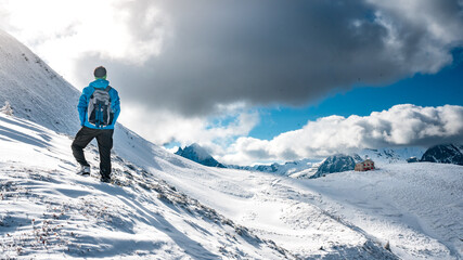 Naklejka na ściany i meble hiker on Col de Balme in snow