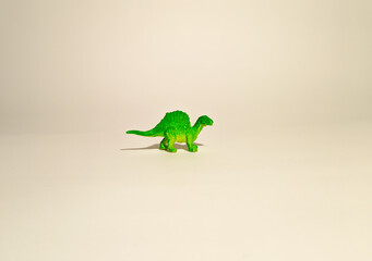
toy dinosaur, green spinosaurus on a white background