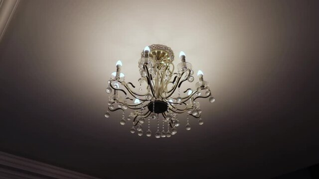 elegant ceiling lamps of an interesting shape in a country house