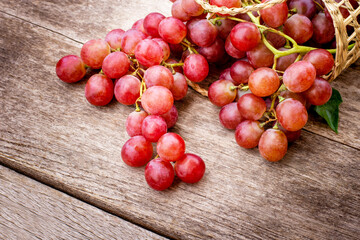 red grapes on wooden background