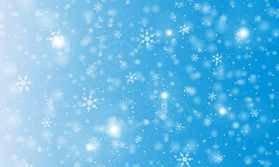 Snow background. Winter snowfall. White snowflakes on blue sky. Christmas background. Falling snow.