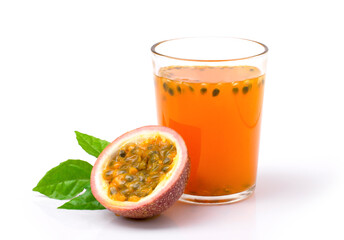 Glass of passionfruit ( maracuya ) juice with passion fruits and half slice with green leaves...