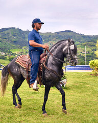 Man riding a horse in farm outdoors. Man on horse galloping outdoor. Life style.