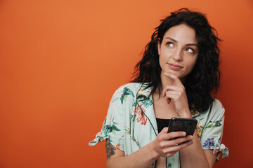 Cheerful happy woman using mobile phone