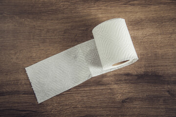 toilet paper on brown background