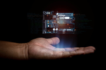 Arduino controller board element photo in dark background with infographic details.
